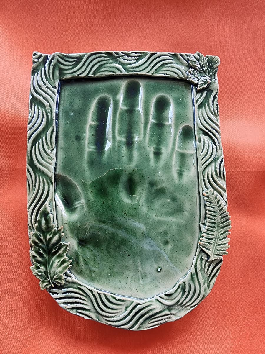 Emerald handprint tile